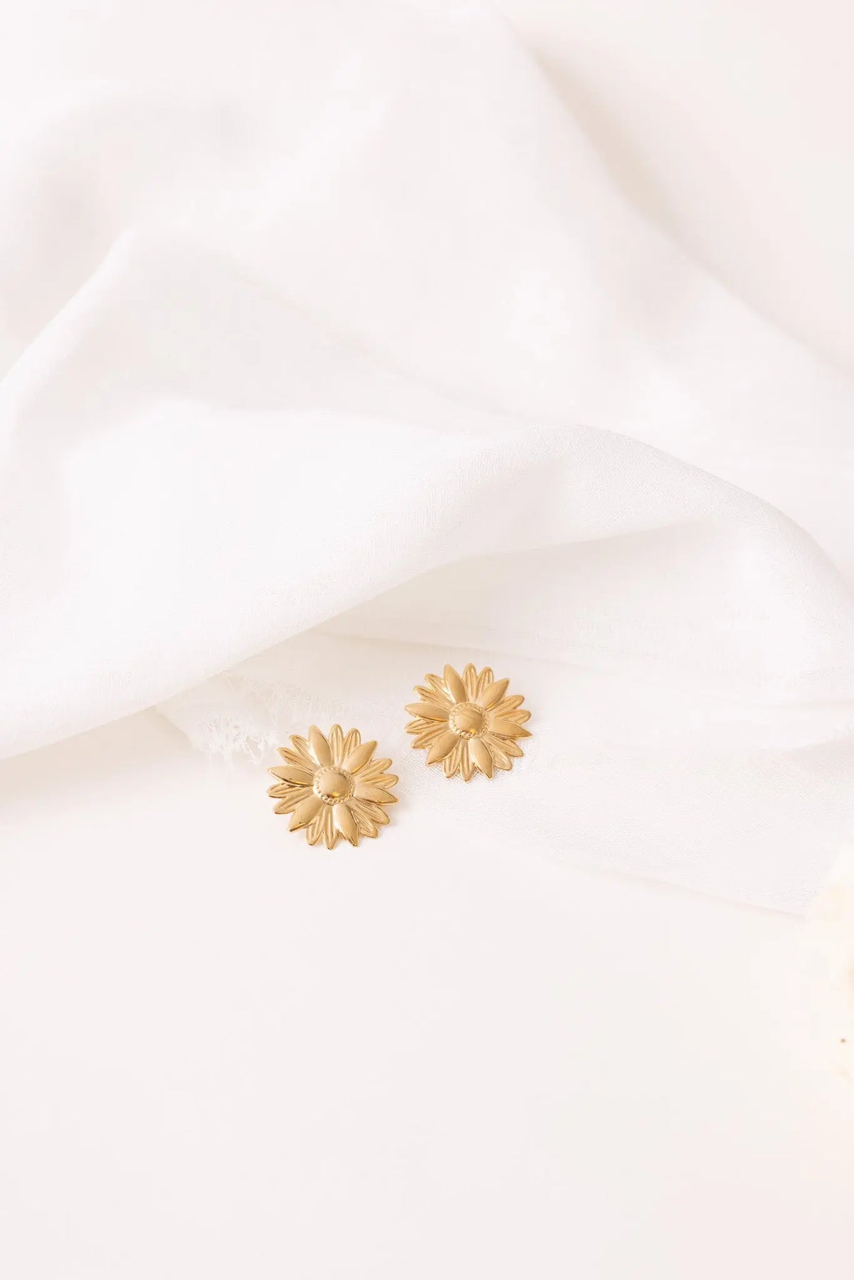 Boucles Marguerite Un de ces quatre 
