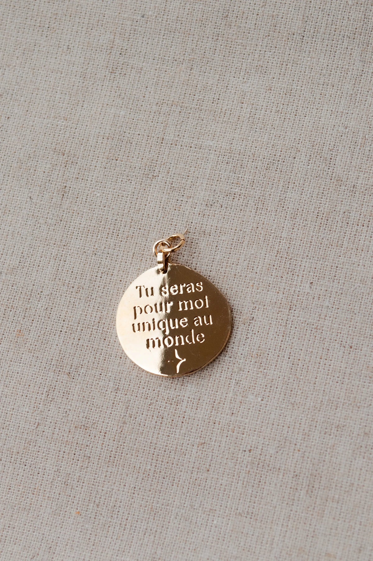 Pendentif "Unique au monde" Un de ces quatre 